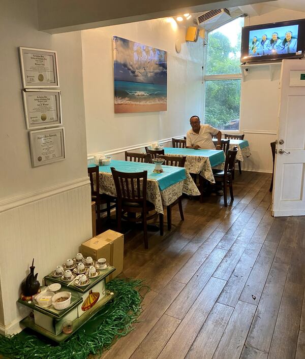 Woinshet Legesse Emory displays her culinary degrees above an Ethiopian coffee service at her Clarkston restaurant, Chef Winnie’s Kitchen. Wendell Brock for The Atlanta Journal-Constitution