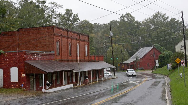 The historic village of Rex contains only a few structures, including the building at left, which at one time housed the bank, blacksmith, and mercantile store. First lady Michelle Obama's has roots to a slave girl named Melvinia Shields and an unknown white man who impregnated Shields while she was living on property in Rex.