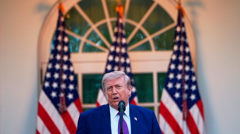 President Donald Trump speaks at a dinner for members of his administration and law enforcement organization leaders, during National Police Week, in the White House Rose Garden, Monday, May 11, 2026, in Washington. (AP Photo/Julia Demaree Nikhinson)