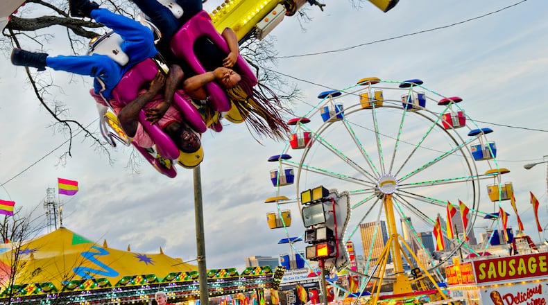 A FAIR EXPERIENCE--March 4, 2015 Atlanta - Christopher Watson (left) and Alisha Medley hang upside down as they ride Experience at the Atlanta Fair on Wednesday, March 4, 2015. The fair runs through April 5. JONATHAN PHILLIPS / SPECIAL