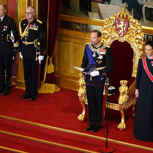 King Haakon VIII., left, takes the oath according to the Constitution in the Storting, Norway's parliament, accompanied by Crown Princess Ingrid Alexandra, right, in Oslo, Norway, Tuesday, Sept. 1, 2026. (Hakon Mosvold Larsen/Pool Photo via AP)