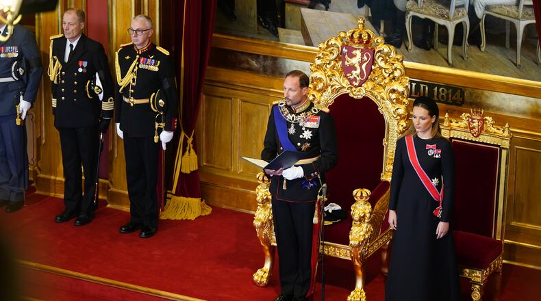 King Haakon VIII., left, takes the oath according to the Constitution in the Storting, Norway's parliament, accompanied by Crown Princess Ingrid Alexandra, right, in Oslo, Norway, Tuesday, Sept. 1, 2026. (Hakon Mosvold Larsen/Pool Photo via AP)