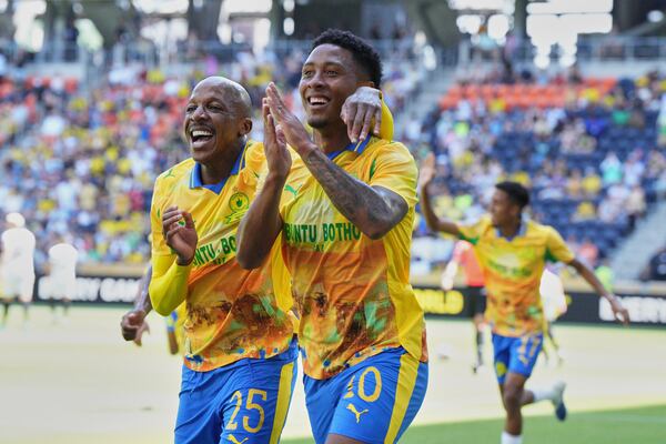 Mamelodi Sundowns' Khuliso Mudau, left, and Lucas Ribeiro Costa celebrate after a goal during the Club World Cup Group F soccer match between Mamelodi Sundowns and Borussia Dortmund in Cincinnati, Saturday, June 21, 2025. (AP Photo/Jeff Dean)