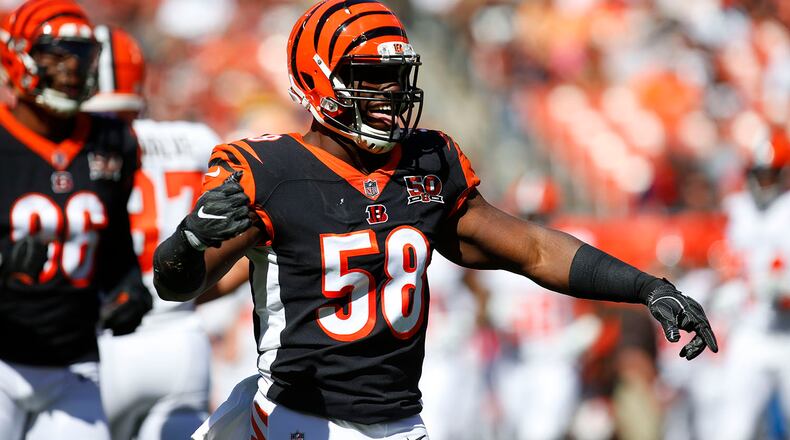 Carl Lawson #58 of the Cincinnati Bengals celebrates a play in the first half against the Cleveland Browns at FirstEnergy Stadium on October 1, 2017 in Cleveland, Ohio