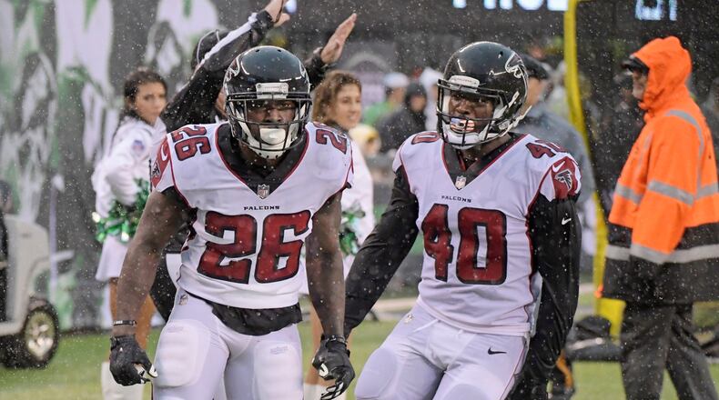 New York Jets free safety Marcus Maye (26) celebrates with teammate Derrick Coleman (40) after a big gain during the second half of an NFL football game against the New York Jets Sunday, Oct. 29, 2017, in East Rutherford, N.J. (AP Photo/Bill Kostroun)