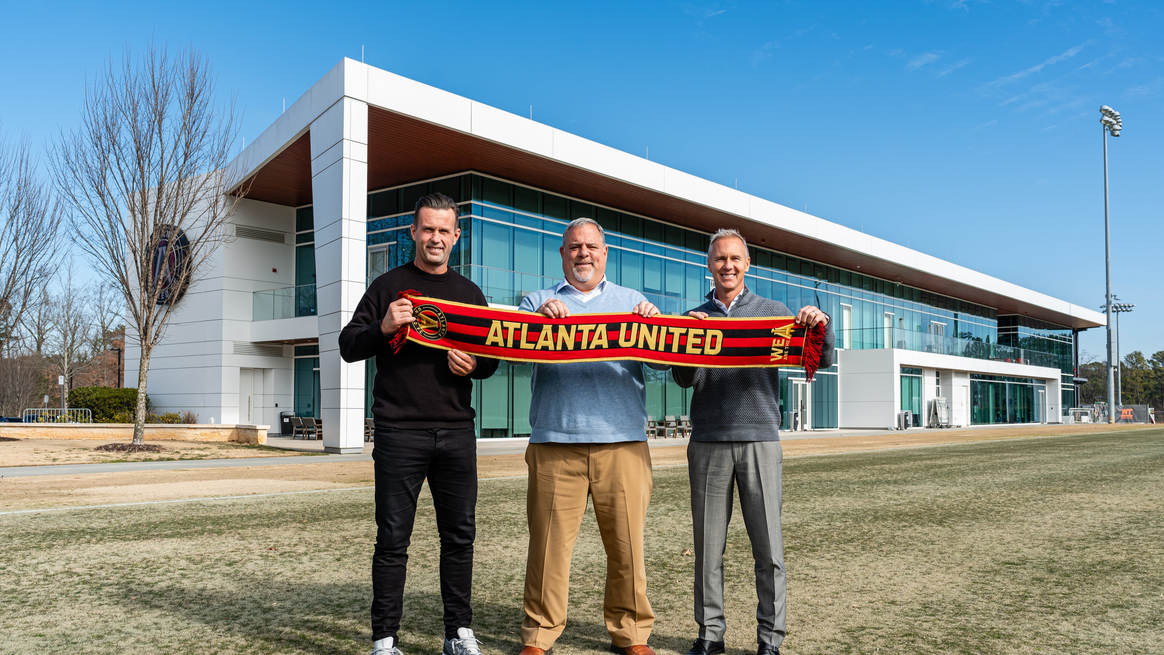 Manager Ronny Deila (from left), President Garth Lagerwey and Sporting Director Chris Henderson stand outside the Children’s Healthcare of Atlanta Training Ground on Wednesday, Jan. 8, 2025, in Marietta. Deila and Henderson are in the first year of their jobs with Atlanta United. (Mitch Martin/Atlanta United)