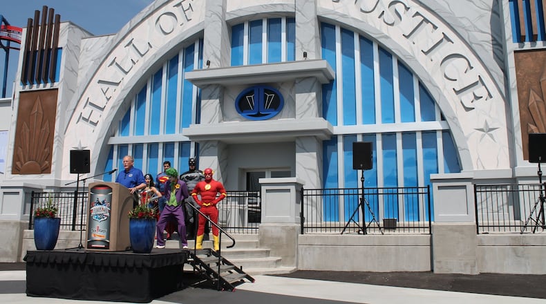 Six Flags Over Georgia President Dale Kaetzel, joined by DC Comics superheroes and villains, introduces the new Justice League: Battle for Metropolis ride at Six Flags Over Georgia on May 11, 2017. TOM KELLEY / TKELLEY@AJC.COM