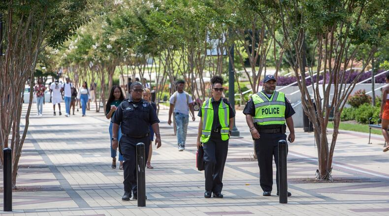 Three Clark Atlanta University police walk through the campus near where shooting broke out during a party on the steps of the Atlanta University Center injuring several students the night before the first day of classes in Atlanta, GA on August 21st, 2019. (Photo by Phil Skinner).