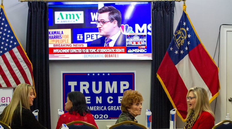 People talk before the start of the Democratic debate at the Cobb County Republican Party Headquarters in Marietta Wednesday, November 20, 2019. STEVE SCHAEFER / SPECIAL TO THE AJC