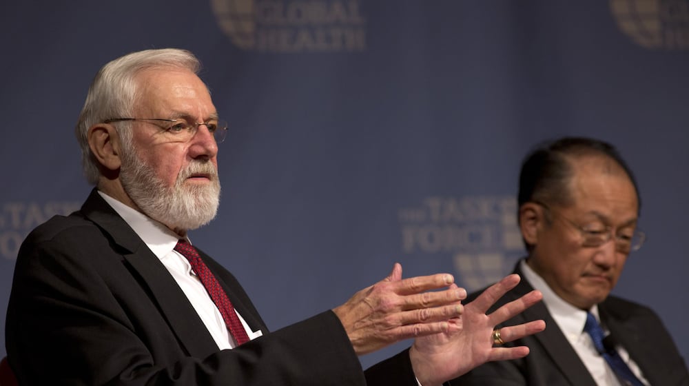 Dr. Bill Foege (left), former director of the Centers for Disease Control and Prevention — pictured speaking alongside World Bank President Dr. Jim Yong Kim at the Carter Center in 2015 — died Saturday, Jan. 24, 2026. (AJC 2015)