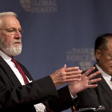 Dr. Bill Foege (left), former director of the Centers for Disease Control and Prevention — pictured speaking alongside World Bank President Dr. Jim Yong Kim at the Carter Center in 2015 — died Saturday, Jan. 24, 2026. (AJC 2015)