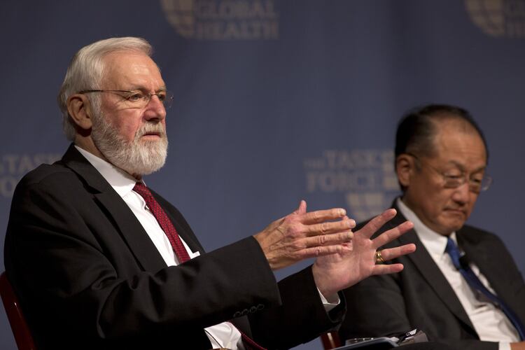 Dr. Bill Foege (left), former director of the Centers for Disease Control and Prevention — pictured speaking alongside World Bank President Dr. Jim Yong Kim at the Carter Center in 2015 — died Saturday, Jan. 24, 2026. (AJC 2015)