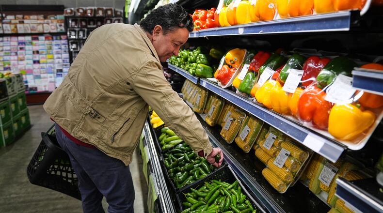 A person shops for produce, which is covered by the USDA Supplemental Nutrition Assistance Program (SNAP), at a grocery store in Baltimore, Thursday, Oct. 30, 2025. (AP Photo/Stephanie Scarbrough)