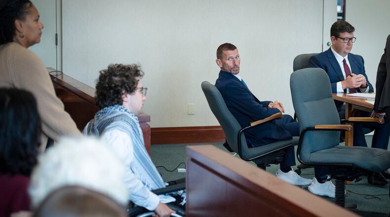 Jason Eaton watches as Hisham Awartani arrives to testify in Eaton's trial in Burlington, Vt., Monday, Sept. 14, 2026. (Glenn Russell/Pool photo via AP)