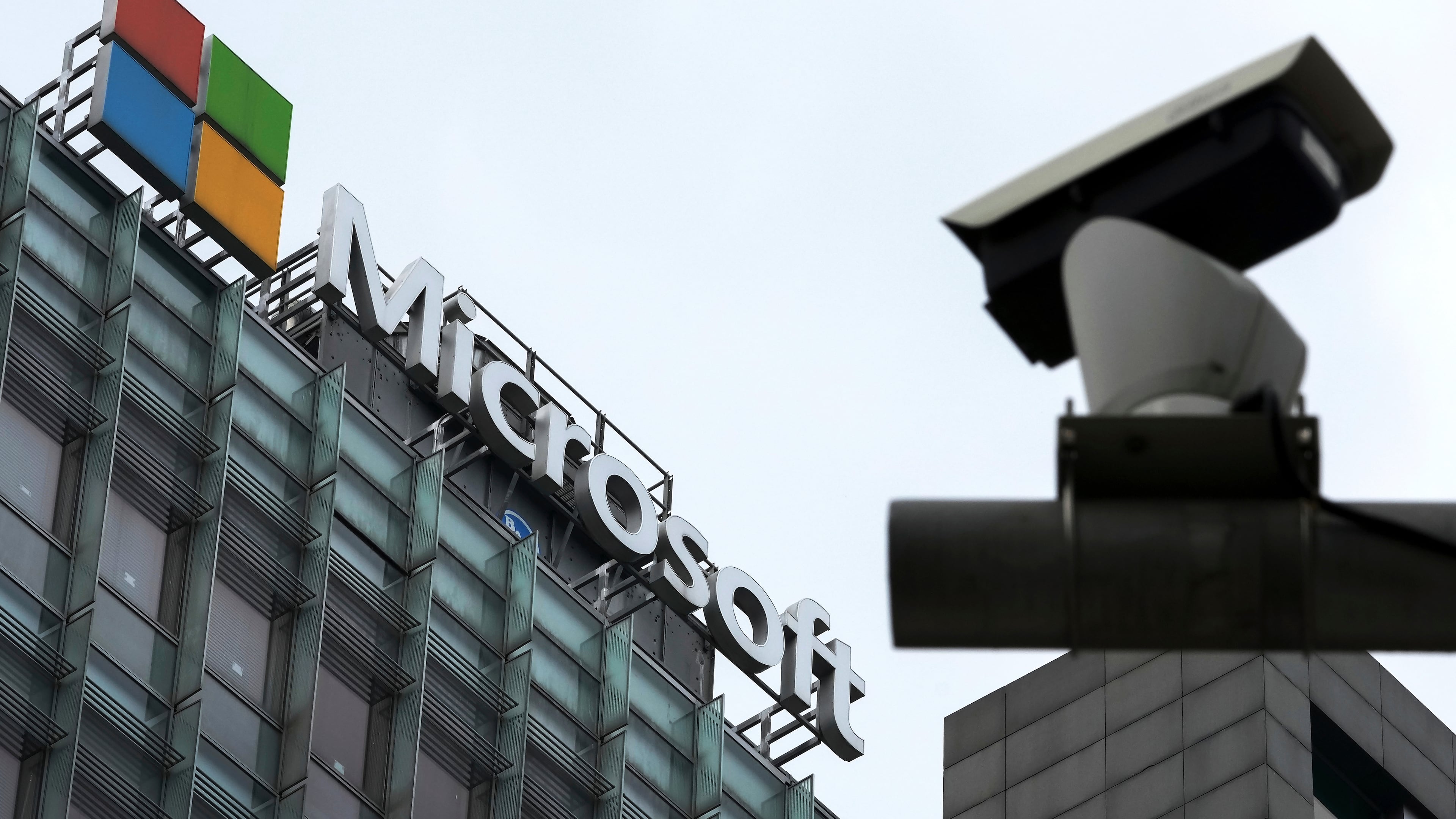 FILE - A security surveillance camera is seen near the Microsoft office building in Beijing, July 20, 2021. (AP Photo/Andy Wong, File)