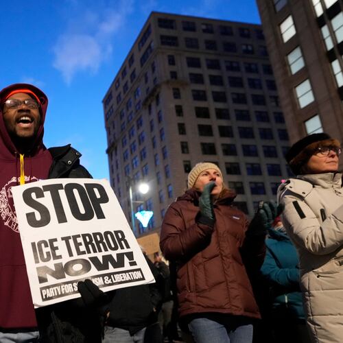 Protesters rally against the presence of U.S. Immigration Customs Enforcement in Maine, Friday, Jan. 23, 2026, in Portland, Maine. (AP Photo/Robert F. Bukaty)