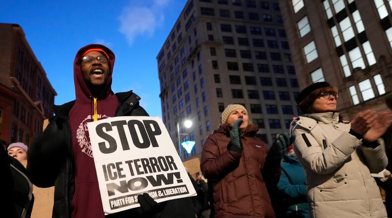 Protesters rally against the presence of U.S. Immigration Customs Enforcement in Maine, Friday, Jan. 23, 2026, in Portland, Maine. (AP Photo/Robert F. Bukaty)