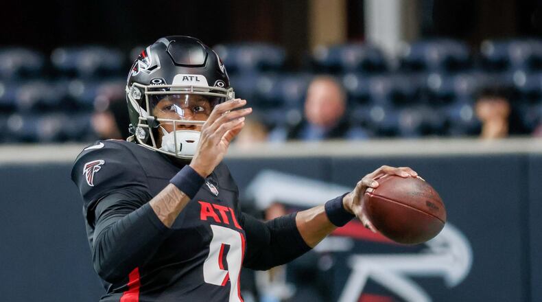 Falcons quarterback Michael Penix Jr. (9) attempts a pass during warm-ups before the Atlanta Falcons and Caroline Panthers Sunday, January 5, 2025, at Mercedes-Benz Stadium in Atlanta. 
(Miguel Martinez/ AJC)