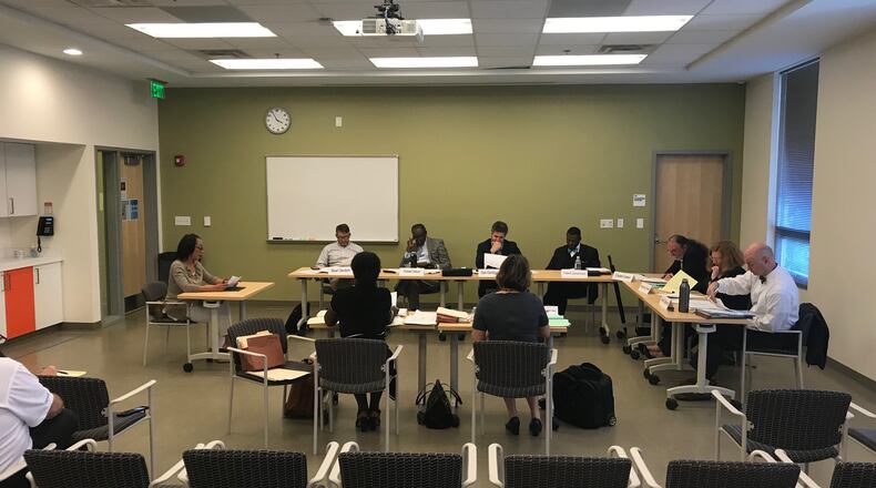Members of the DeKalb County Board of Ethics listen to testimony during a hearing on May 17, 2018. TIA MITCHELL/TIA.MITCHELL@AJC.COM