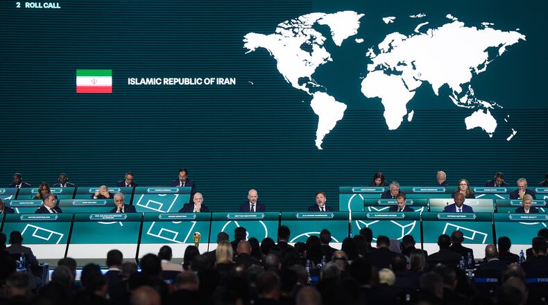 Iran is marked absent as FIFA Secretary General Mattias Grafstrom, fourth from front left, conducts roll call during the 76th FIFA Congress in Vancouver, British Columbia, Thursday, April 30, 2026. (Darryl Dyck/The Canadian Press via AP)