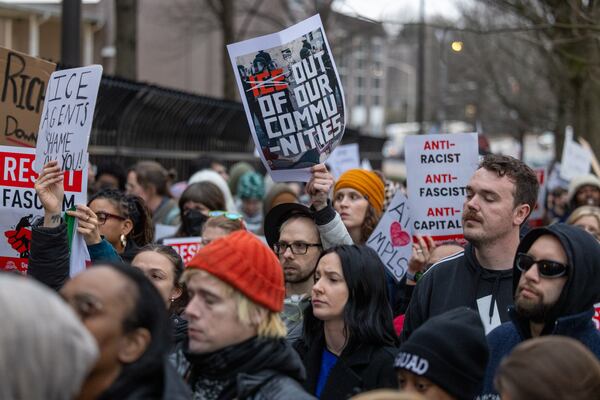 Demonstrators protest against U.S. Immigration and Customs Enforcement in front of the Atlanta Field Office in January. (Arvin Temkar/AJC)