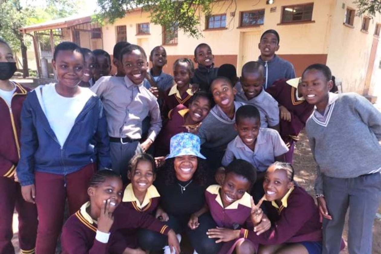 Children from a local village in Botswana gather for a photo with Peace Corps volunteer Shanya McWhinney. (Photo provided by Shanya McWhinney)