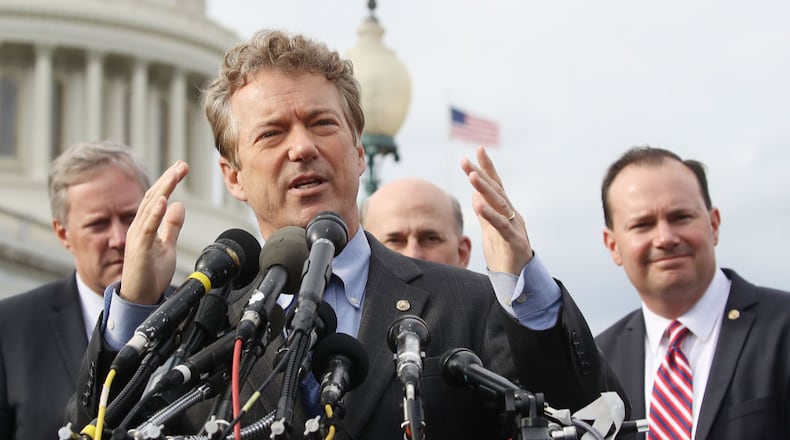 WASHINGTON, DC - MARCH 07: Sen. Rand Paul (R-KY) (C) speaks about Obamacare repeal and replacement while flanked by Sen. Mike Lee (R-UT) (R), and  Rep. Mark Meadows (R-NC) (L) during a news conference on Capitol Hill, on March 7, 2017 in Washington, DC.