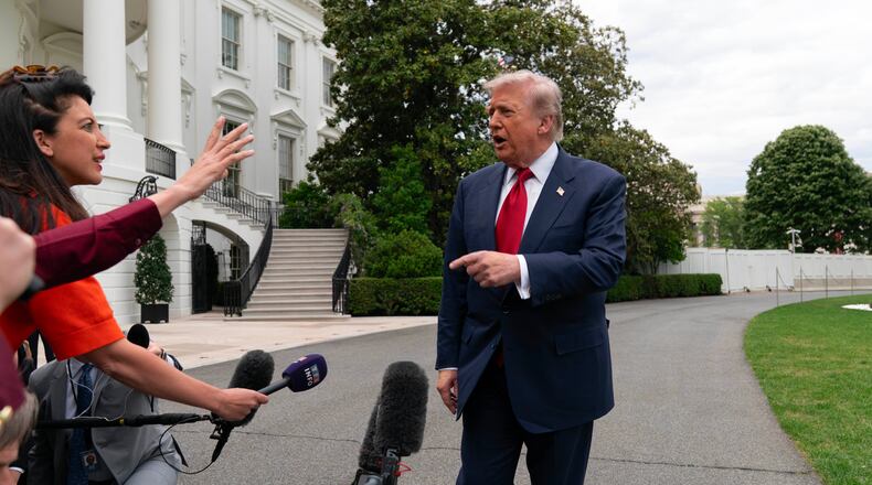 President Donald Trump speaks to reporters as he walks to board Marine One on the South Lawn of the White House, Friday, May 8, 2026, in Washington. (AP Photo/Jose Luis Magana)