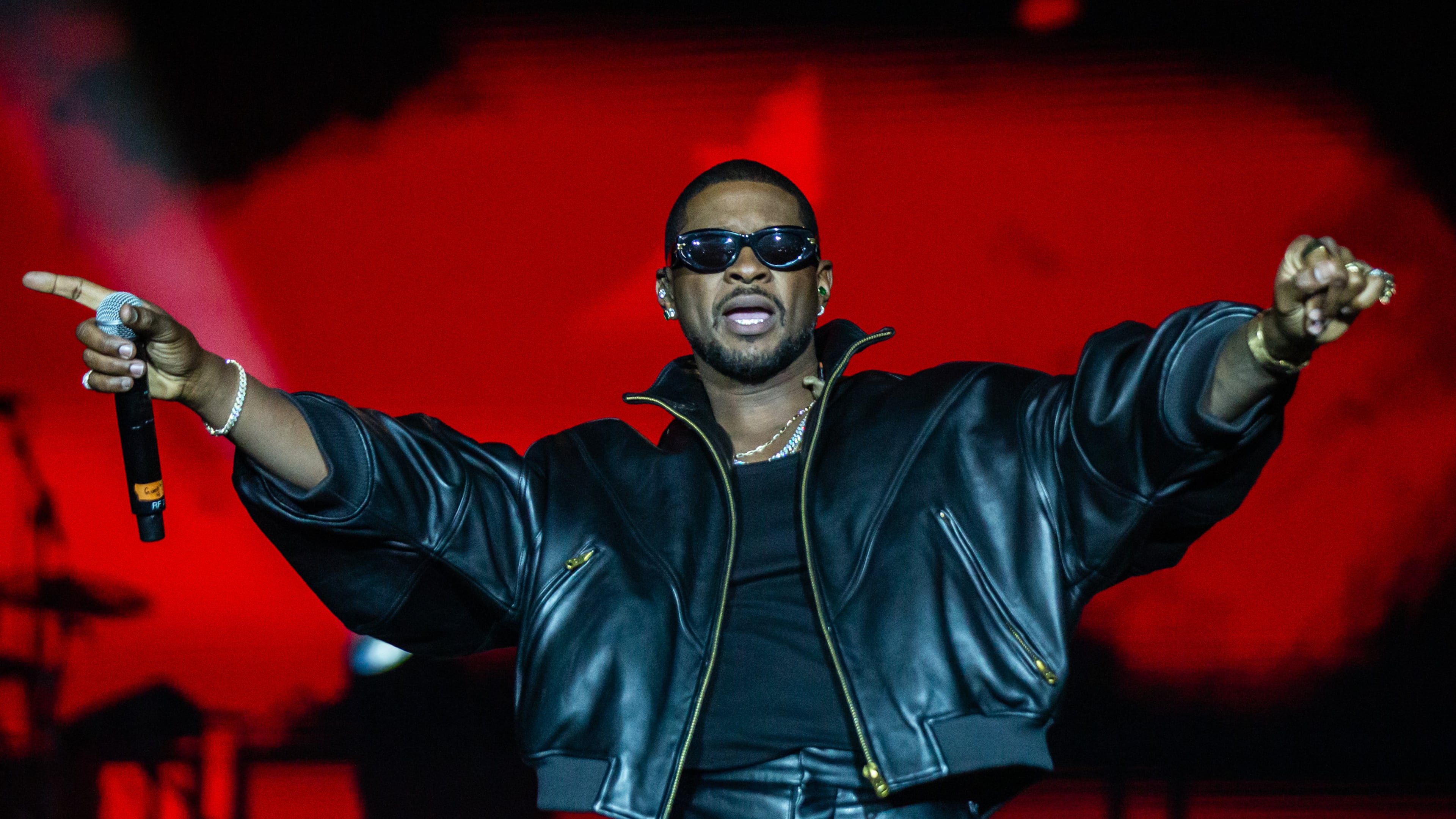 Atlanta singer Usher performs at Piedmont Park in October. He is suing music producer Bryan-Michael Cox and others over a failed Buckhead restaurant deal. (Ryan Fleisher for the AJC)