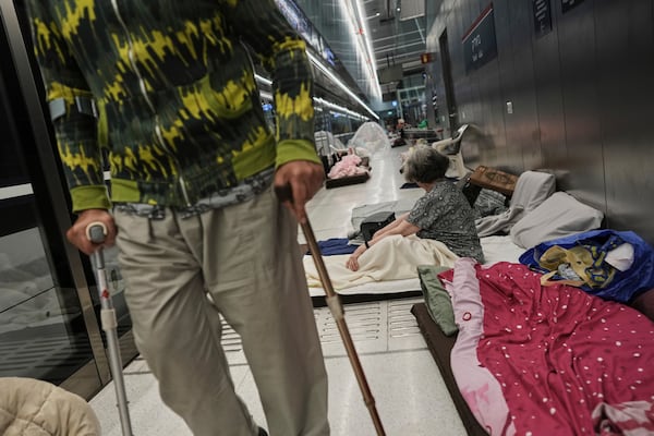 People shelter in an underground metro station as air raid sirens warn of incoming strikes by Iran, in Ramat Gan, near Tel Aviv, Israel, Wednesday, June 18, 2025. (AP Photo/Oded Balilty)