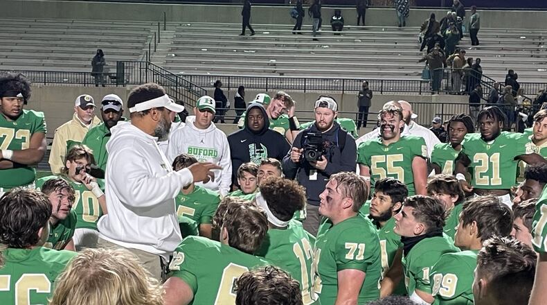 Buford head coach Bryant Appling talks with his team following its 21-6 victory over Carrollton in the Class 6A semifinals on Dec. 3, 2021.