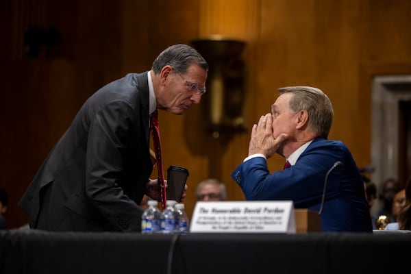 Senator John Barrasso (R-WY) talks with Former U.S. Sen. David Perdue, who has been tapped by President Donald Trump to serve as ambassador to China, ahead of his nomination hearing in front of the Senate Committee on Foreign Relations in Washington, DC on April 3, 2025. (Nathan Posner for the Atlanta Journal-Constitution)