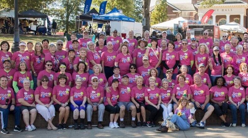 Thanks to the efforts of these Duluth Fall Festival volunteers, the 501(c)3 organization was able to donate $120K to the city for a variety of projects. Courtesy Duluth Fall Festival