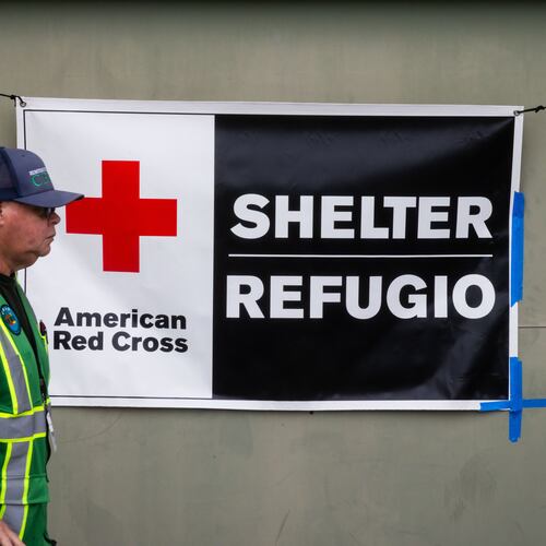 An American Red Cross volunteer walks outside Freedom Hall, an evacuation center in Fountain Valley, Calif.,on Monday, May 25, 2026. (AP Photo/Ethan Swope)