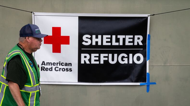 An American Red Cross volunteer walks outside Freedom Hall, an evacuation center in Fountain Valley, Calif.,on Monday, May 25, 2026. (AP Photo/Ethan Swope)