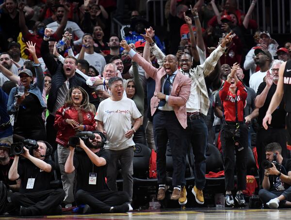 Hawks fans react after the game-winning shot by Trae Young. (Hyosub Shin / Hyosub.Shin@ajc.com)