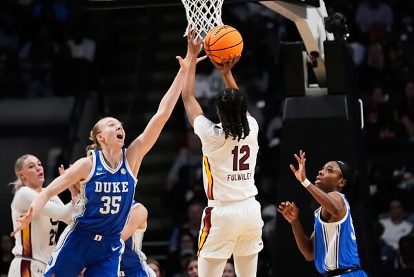 South Carolina guard MiLaysia Fulwiley (12) shoots against Duke forward Toby Fournier (35) during the first half in the Elite Eight of the NCAA college basketball tournament, Sunday, March 30, 2025. in Birmingham, Ala. (AP Photo/Gerald Herbert)