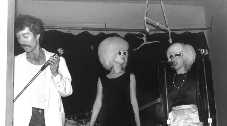Fred Schneider (from left), Cindy Wilson and Kate Pierson of the B-52s perform during the band’s debut at an Athens Valentine’s Day party in 1977. CONTRIBUTED BY KELLY BUGDEN AND KEITH BENNETT