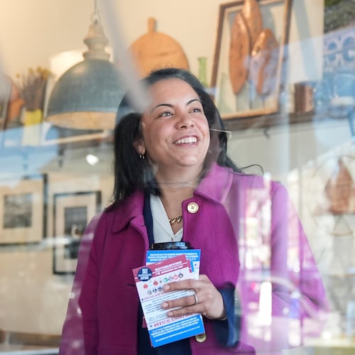 Analilia Mejia, the Democratic candidate running for New Jersey's 11th congressional district, talks to people at coffee shop in Morristown, N.J., Tuesday, March 24, 2026. (AP Photo/Seth Wenig)