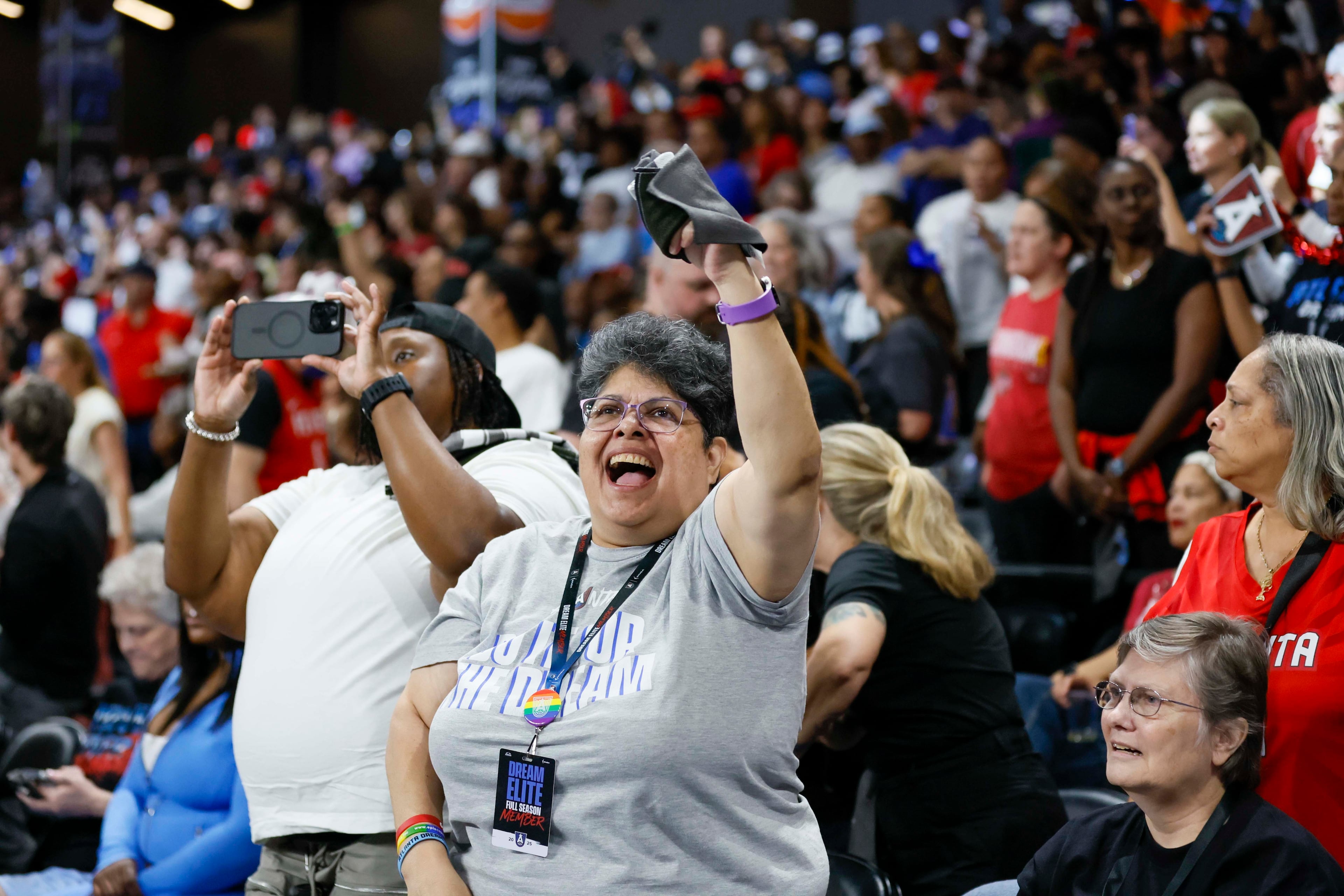Atlanat Dream fans cheer at the end of the first half of a WNBA first-round playoff game against the Indiana Fever at Gateway Center Arena on Thursday, Sept. 18, 2024, in Atlanta. (Miguel Martinez/ AJC)