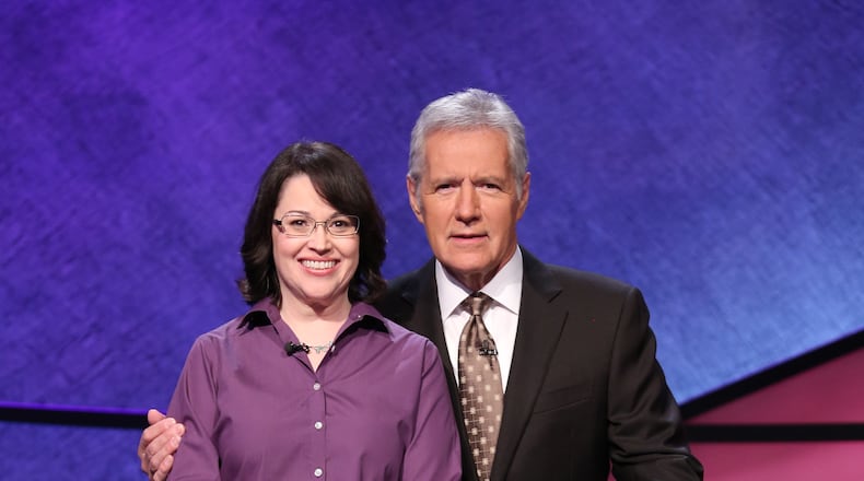 Robin Carroll of Marietta with Alex Trebek. She is moving to the semifinals of the Tournament of the Decades to air in May.