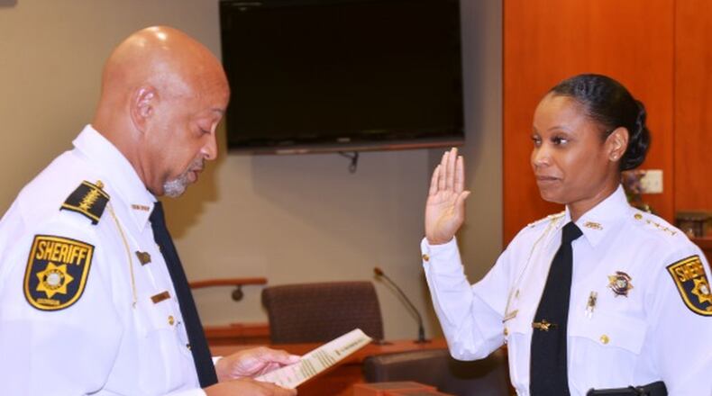 DeKalb Sheriff Jeffrey Mann (left) swears in new Chief Deputy Melody Maddox on July 11. (Photo courtesy of DeKalb County Sheriff’s Office)