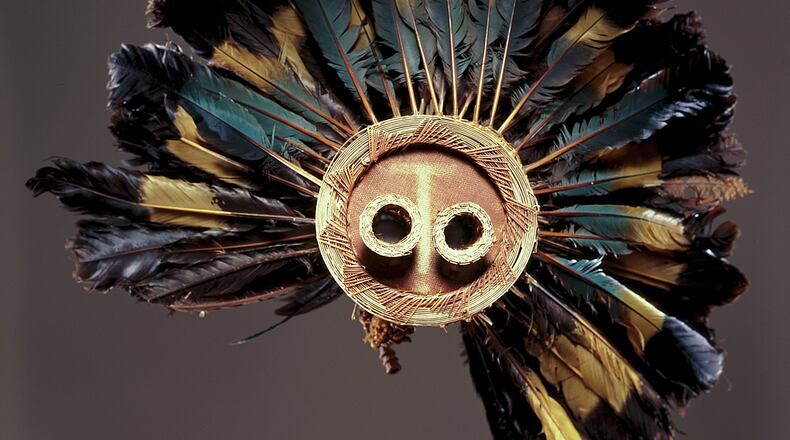 A Pende mask from the Democratic Republic of the Congo. The piece was made in the late-19th or early-20th century, of great blue turaco feathers, fiber, and wood. It's part of the High Museum of Art.'s African Art collection.