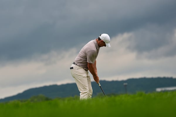 Rory McIlroy, of Northern Ireland, putts on the ninth hole during the third round of the U.S. Open golf tournament at Oakmont Country Club Saturday, June 14, 2025, in Oakmont, Pa. (AP Photo/Charlie Riedel)