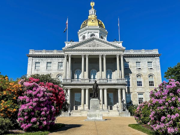 FILE - Flowers bloom outside the New Hampshire Statehouse on June 1, 2024, in Concord, N.H. (AP Photo/Holly Ramer, file)