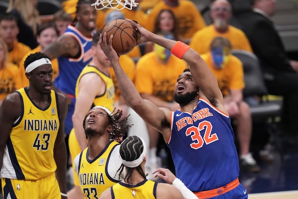 New York Knicks center Karl-Anthony Towns (32) shoots against the Indiana Pacers during the first half of Game 3 of the Eastern Conference finals of the NBA basketball playoffs Sunday, May 25, 2025, in Indianapolis. (AP Photo/AJ Mast)