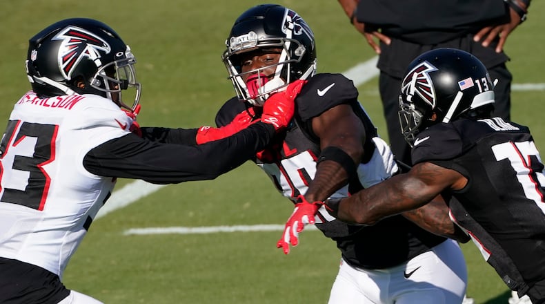 Atlanta Falcons wide receiver Russell Gage (83) works with Jordan Miller (28) and Atlanta Falcons wide receiver Christian Blake (13) during an NFL football practice Tuesday, Aug. 18, 2020, in Flowery Branch, Ga. (AP Photo/John Bazemore, Pool)