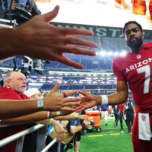 Arizona Cardinals' Jacoby Brissett (7) greets fans as he walks off the field following an NFL football game against the Dallas Cowboys Monday, Nov. 3, 2025, in Arlington, Texas. (AP Photo/Richard Rodriguez)