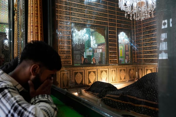 Kashmiri Muslims pray inside the shrine of Sheikh Abdul Qadir Jeelani, commonly known as Dastageer Sahib, in Srinagar, Indian controlled Kashmir, Wednesday, April 2, 2025. (AP Photo/Mukhtar Khan)