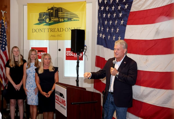 Mike Collins speaks during his watch party for Georgia’s 10th Congressional District runoff at The Brickery, Tuesday, June 21, 2022, in Jackson, Ga. Also shown from left: the niece of Mike Collins, Katherine Piper, Mike Collins’ daughter Summer and his wife Leigh Ann. Collins is a trucking company owner and son of the late congressman Mac Collins. (Jason Getz/AJC)